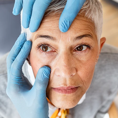 Elderly patient being examined for cataracts