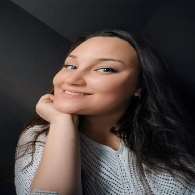 A headshot photo of Marlaina